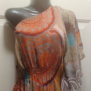 The "Bisou Bisou" mini dress in orange and blue with a flowy design